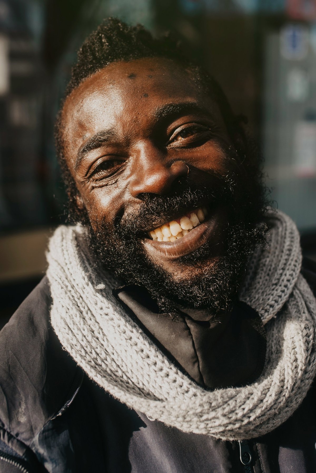 A portrait of a black man in a street